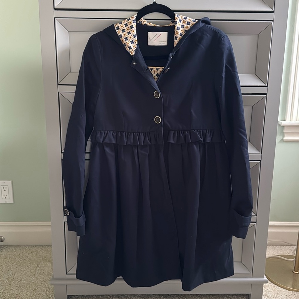 Navy A-line coat with peplum detail